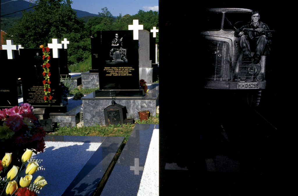 Laser-engraved headstones of Bosnian Serb soldiers who were killed during the war. The cemetery is in Visegrad, in eastern Bosnia, a town where some 2,000 Muslim men and boys were killed by Serbs in the spring of 1992. Eight years after the end of the war, the former Muslim-majority town remains overwhelmingly Serb. Photo courtesy of Sara Terry and the Aftermath Project.