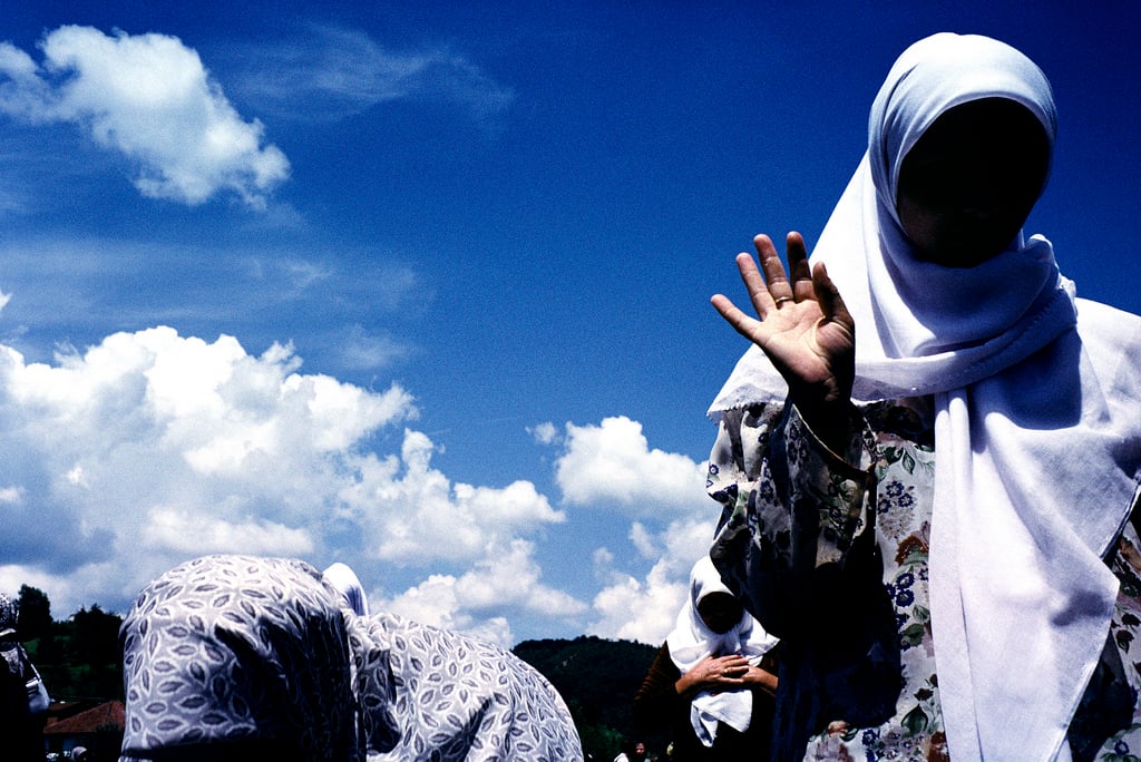Muslim widows during the prayer for the dead offered at the groundbreaking of a memorial site for the 7,000 to 8,000 Muslim men and boys who were massacred by Bosnian Serb forces in 1995. Courtesy of Sara Terry.