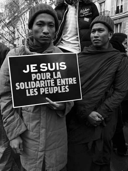 Parisians come together in support of the victims of the "Charlie Hebdo" shooting on January 11, 2015. Photo courtesy of Passion Leica, Wikimedia Commons.