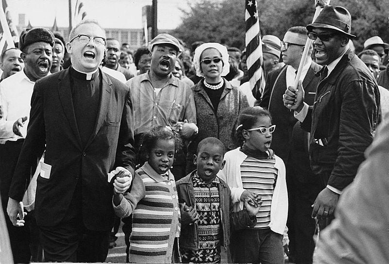 Dr. Ralph David Abernathy and his wife, Mrs. Juanita Abernathy, follow with Dr. and Mrs. Martin Luther King, Jr. as the Abernathy children march on the front line, leading the Selma to Montgomery March in 1965. Photo courtesy of the Abernathy Family.