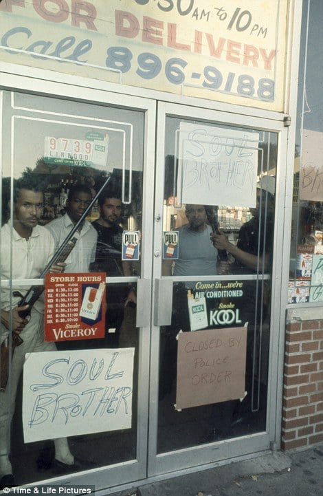 African American store owners protecting their store in the aftermath of the Detroit riots of 1967. Copyright Time and Life Pictures.