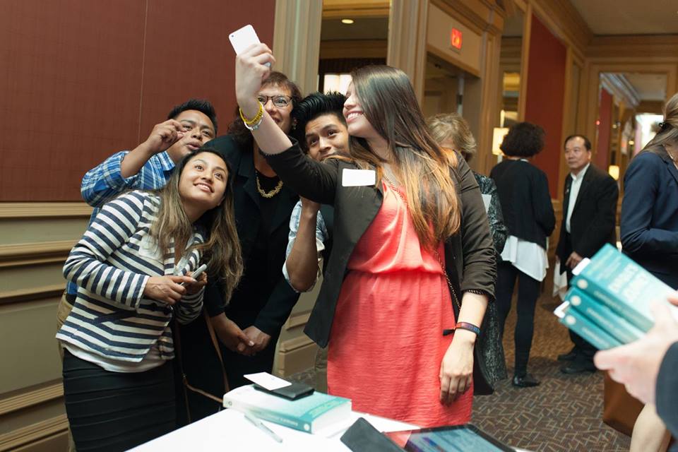 Students taking selfies with Sonia during one of her speaking tours.