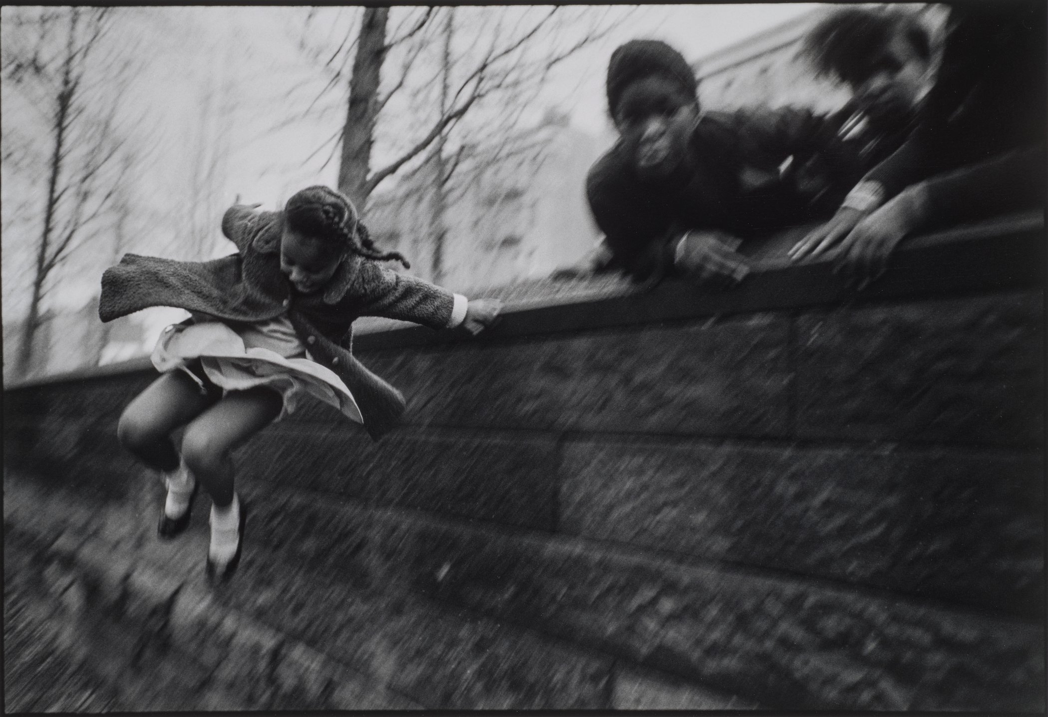 Mary Ellen Mark, Girl Jumping over a Wall, Central Park, New York City, 1967 (printed later); Gelatin silver print, 16 x 20 in.; NMWA, Gift of Jill and Jeffrey Stern; Photo by Lee Stalsworth; © Mary Ellen Mark/The Mary Ellen Mark Foundation
