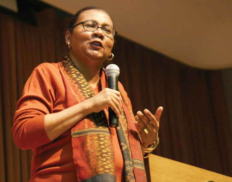 bell hooks addressing an audience (public domain, 2009).