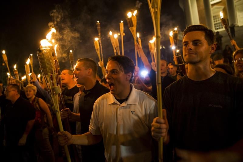 Protester with torches at the Unite the Right Rally in Charlottesville, VA in 2017