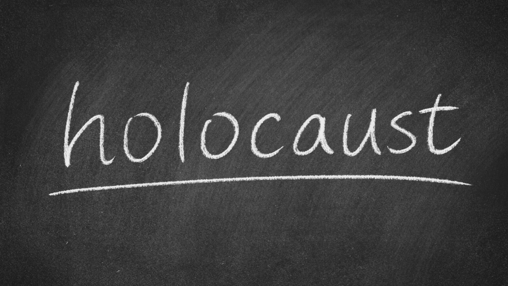 Blackboard with "holocaust" written in white chalk.