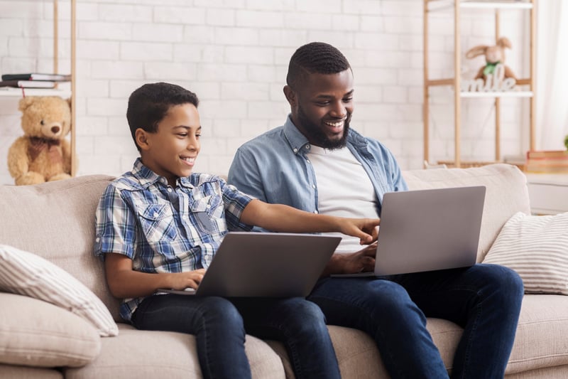 Father and son enjoying school and work from home