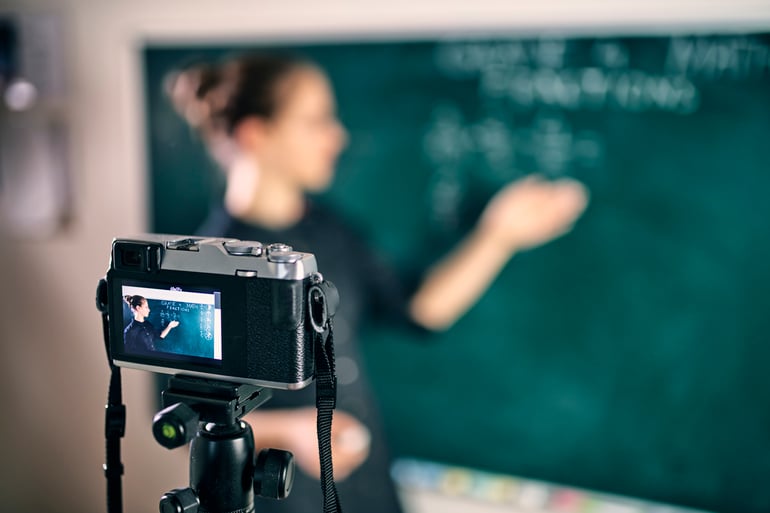 Image of teacher streaming her lesson from the classroom